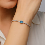 Elegant Silver Tennis Bracelet with Blue Crystal Centerpiece
